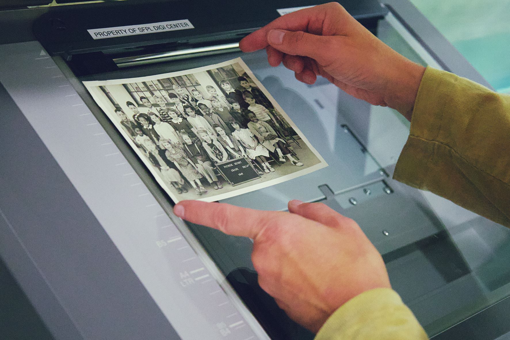 Hands scanning image of class picture 