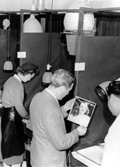 Adult students working in the enlarging and developing section of the Galileo High School photography laboratory