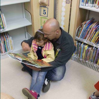 family reading at ingleside branch