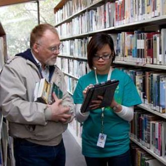 librarian assisting patron