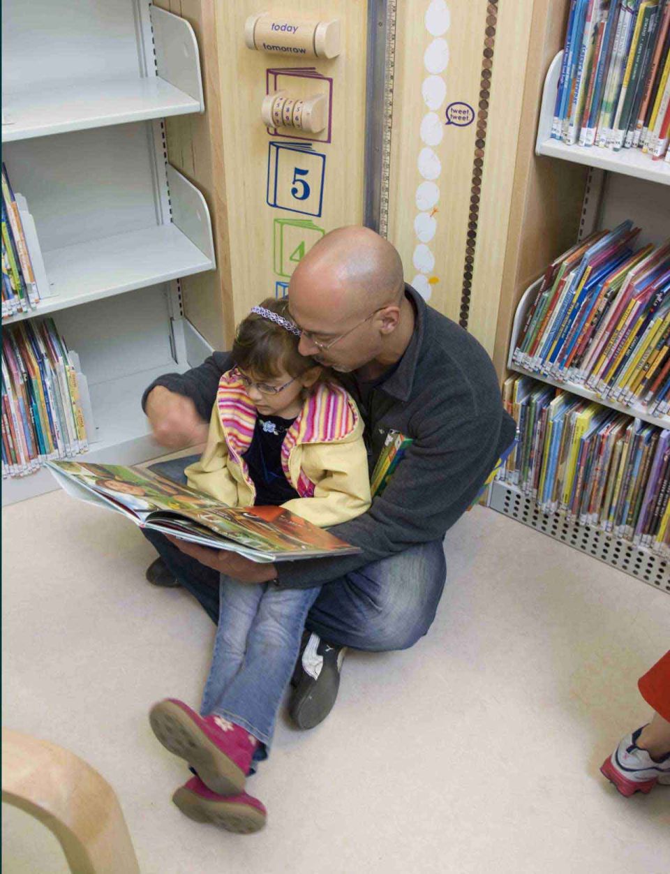 family reading at ingleside branch